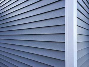 Vinyl siding contractors LBI, Close-up of corner of house with blue vinyl siding