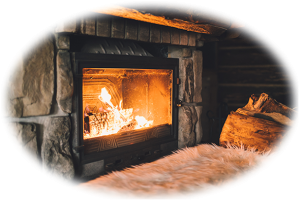 Barnegat chimney service, Fire in stone fireplace with fluffy white rug in front and large log on side